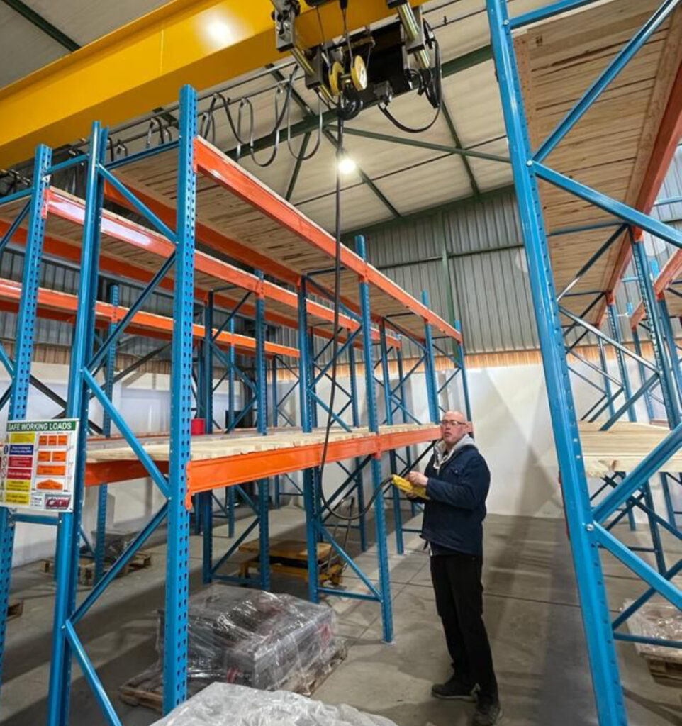 Employees in toolroom working on machinery